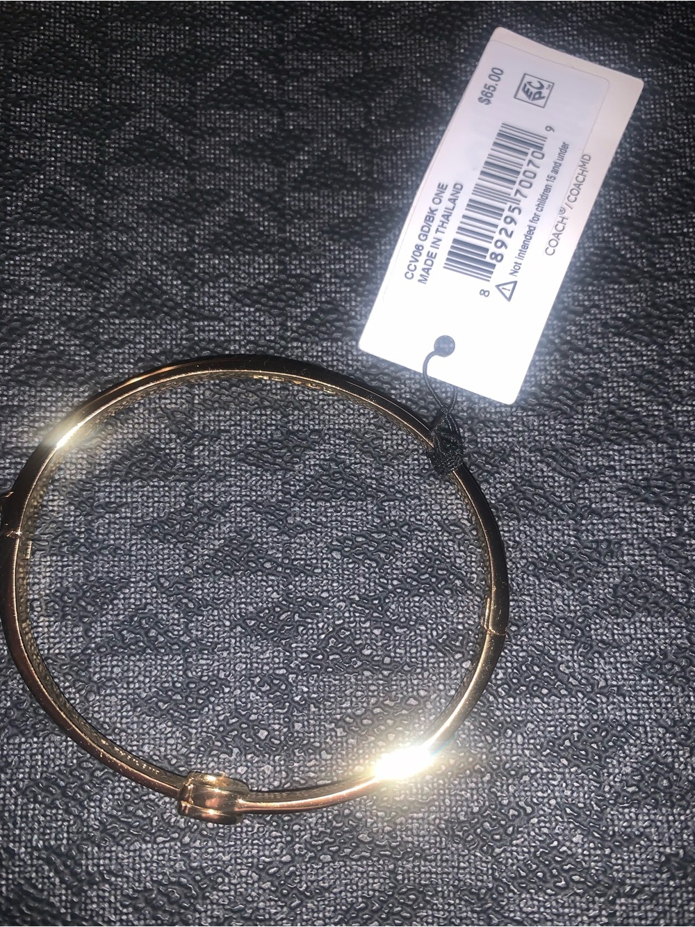 Coach Gold-Tone Knot Bangle Bracelet